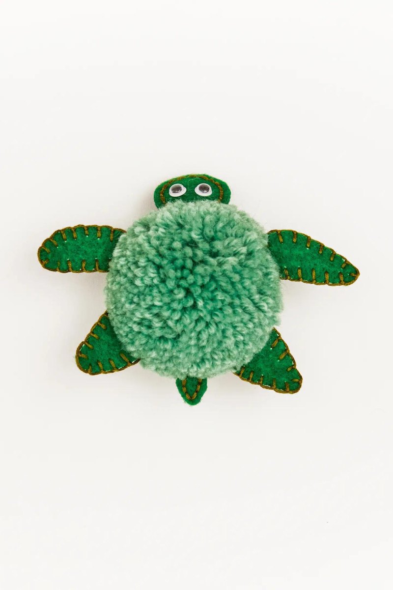 Schild en poten van pom pom schildpad