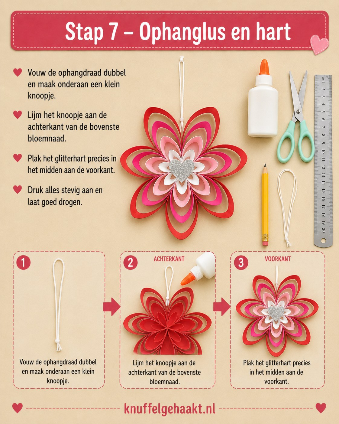 Ophangdraad en glitterhart bevestigd op de achter- en voorkant van de papieren bloem hanger