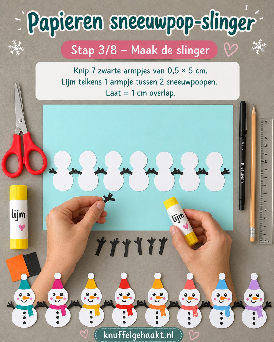 Zwarte armpjes verbinden acht sneeuwpoppen tot een slinger tijdens het papierknutselen